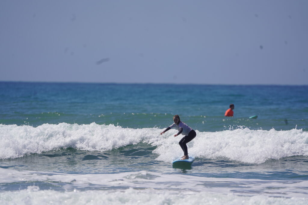 Guest surfing during surf lesson in Morocco